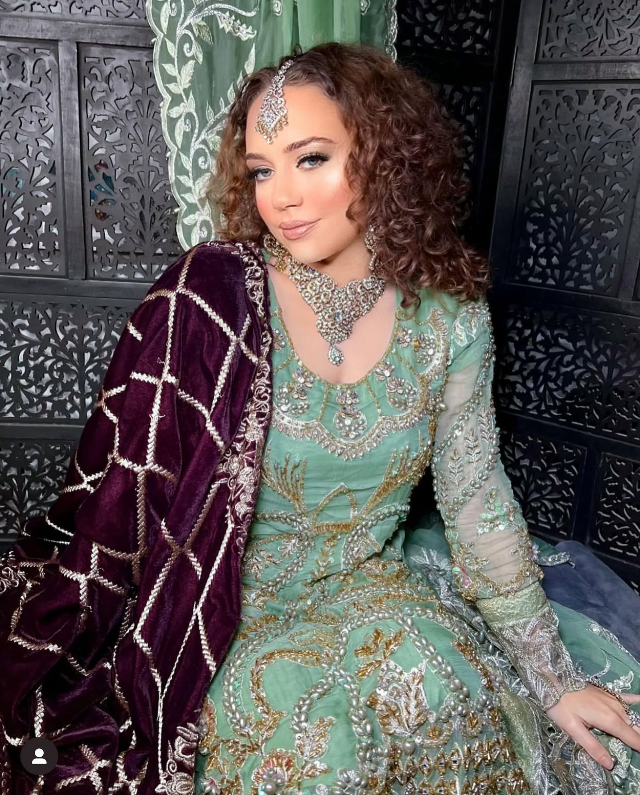 Elegant bride wearing Zahrah bridal accessories including maang tikka, nose pin, and matching jewellery set